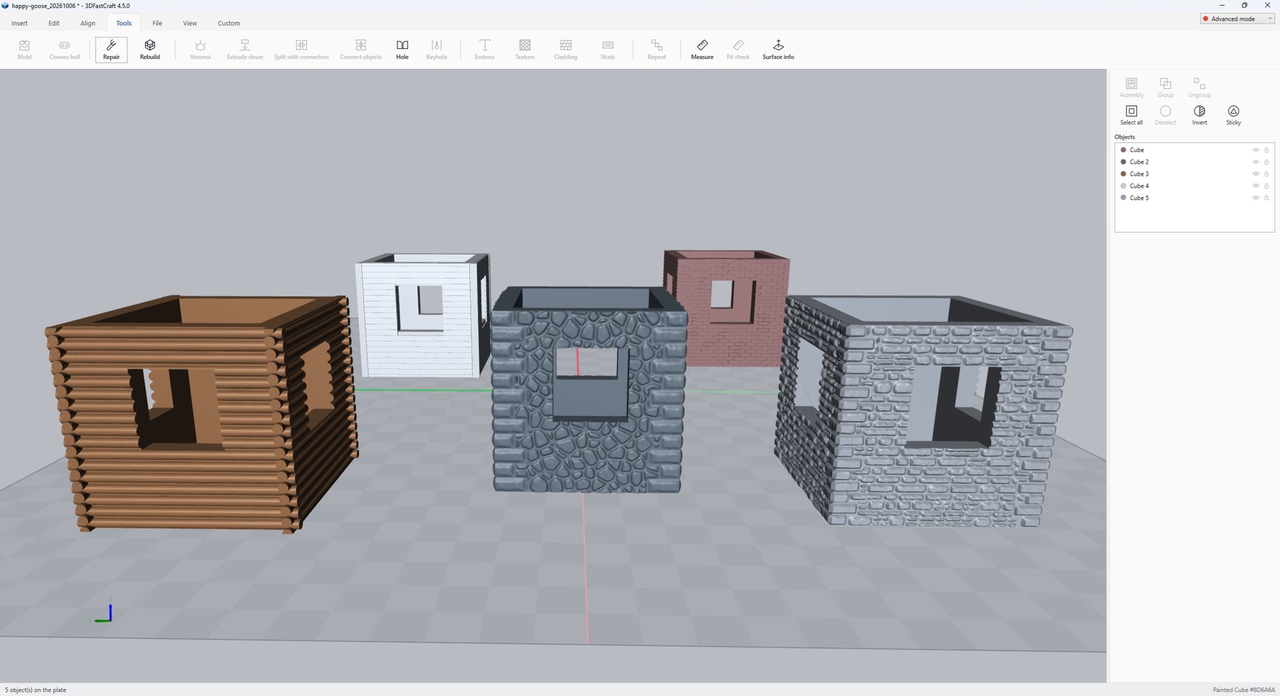 3DFastCraft with five small houses on the plate, each with a different cladding: log walls, siding, a rubble wall, brick and a coursed stone wall
