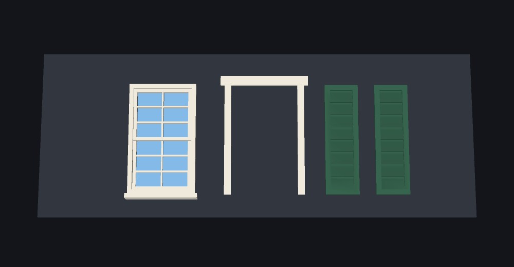 A model window lying flat, facade up, with its trim and a pair of louvered shutters laid out beside it on the plate